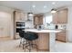 Modern kitchen featuring a large island, stainless steel appliances, and stylish pendant lighting at 15192 Montfort Dr, Noblesville, IN 46062