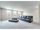 Cozy living room featuring plush sectional seating and multiple windows at 15192 Montfort Dr, Noblesville, IN 46062
