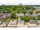 An aerial shot displays a two-story home on a well-maintained lot, accented by mature trees at 1531 N College Ave, Indianapolis, IN 46202