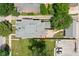 Overhead view of the home's roof, brick patio, fenced yard, driveway, and landscaping at 1531 N College Ave, Indianapolis, IN 46202