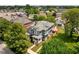 An aerial view features a two-story home with blue siding and mature trees at 1531 N College Ave, Indianapolis, IN 46202