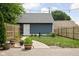 Backyard with a garden area, wooden fencing and paved walkway at 1531 N College Ave, Indianapolis, IN 46202