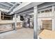 Unfinished basement features painted brick walls, painted ceiling, concrete floor and ample space for storage and utilities at 1531 N College Ave, Indianapolis, IN 46202