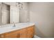 Bathroom featuring single vanity, mirror and cabinet at 1531 N College Ave, Indianapolis, IN 46202