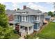 Impressive two-story home featuring a classic design, landscaped yard, and inviting front porch at 1531 N College Ave, Indianapolis, IN 46202