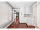 Bright kitchen showcasing white cabinetry, subway tile backsplash, and hardwood floors at 1531 N College Ave, Indianapolis, IN 46202