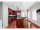 Open kitchen featuring stainless appliances, granite countertops, and a large island with bar seating at 1531 N College Ave, Indianapolis, IN 46202
