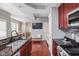 Spacious kitchen with hardwood floors, a kitchen island and stainless steel appliances at 1531 N College Ave, Indianapolis, IN 46202