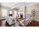 Cozy living room with a brick fireplace, neutral decor, and hardwood floors at 1531 N College Ave, Indianapolis, IN 46202