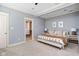 Bright main bedroom showcasing neutral tones and access to a walk-in closet at 1531 N College Ave, Indianapolis, IN 46202