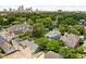 A beautiful neighborhood with mature trees, manicured lawns, and a clear view of the city skyline at 1531 N College Ave, Indianapolis, IN 46202