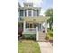 Charming front porch with white columns, a welcoming entrance, and freshly landscaped garden at 1531 N College Ave, Indianapolis, IN 46202