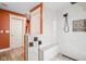 Bathroom featuring a sleek walk-in shower, a built-in bench, and modern finishes at 1531 N College Ave, Indianapolis, IN 46202