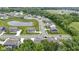 Aerial view showing the neighborhood layout with a pond and several homes at 15546 Senita Ln, Fishers, IN 46037