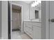 Well-lit bathroom featuring a double sink vanity, white cabinets, and a shower/tub combo at 15546 Senita Ln, Fishers, IN 46037