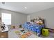 Bright bedroom showcasing a sports-themed bed, a Minecraft rug, and neutral-colored walls and carpet at 15546 Senita Ln, Fishers, IN 46037