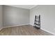 Simple yet functional bedroom space, showing a minimal design with hardwood flooring and neutral colors for versatile use at 15546 Senita Ln, Fishers, IN 46037