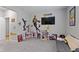 Bedroom with grey carpet, posters, and a TV at 15546 Senita Ln, Fishers, IN 46037