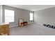This empty room boasts plenty of natural light, neutral walls, and plush carpet providing endless possibilities at 15546 Senita Ln, Fishers, IN 46037