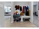 Mudroom with built in storage, bench, and coat rack at 15546 Senita Ln, Fishers, IN 46037