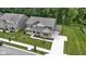An exterior shot showing the home's manicured lawn and beautiful landscaping at 15546 Senita Ln, Fishers, IN 46037