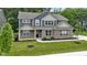 Lovely front yard view, showing the details of the home's brick and blue siding at 15546 Senita Ln, Fishers, IN 46037