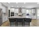 Modern kitchen with stainless steel appliances, sleek countertops, and a central island with bar seating at 15546 Senita Ln, Fishers, IN 46037