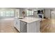 Beautiful kitchen island featuring a stainless dishwasher and a view into the living room at 15546 Senita Ln, Fishers, IN 46037