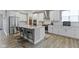 Stylish kitchen with stainless appliances, central island with seating, and ample counter space at 15546 Senita Ln, Fishers, IN 46037
