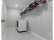 Functional laundry room with modern washer and dryer, tile floors, and overhead shelving at 15546 Senita Ln, Fishers, IN 46037