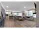 Spacious living area with an open floor plan connecting the kitchen and offering abundant natural light at 15546 Senita Ln, Fishers, IN 46037
