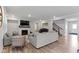 Cozy living room with a fireplace, recessed lighting, hardwood floors, and comfortable seating arrangement at 15546 Senita Ln, Fishers, IN 46037