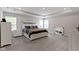 Bright main bedroom featuring plush carpet, tray ceiling, and windows for natural light at 15546 Senita Ln, Fishers, IN 46037