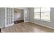 Bright and airy office space with natural light, hardwood floors, and glass French doors for a private workspace at 15546 Senita Ln, Fishers, IN 46037