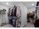 The walk-in closet features ample hanging space, shelving, and carpet flooring for optimal organization at 15546 Senita Ln, Fishers, IN 46037