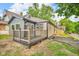 The exterior showcases a charming patio with wooden railings, blending seamlessly with the home's exterior design at 1555 N Dearborn St, Indianapolis, IN 46201