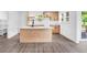 Well-lit kitchen with a center island, modern appliances, and hardwood floors at 1555 N Dearborn St, Indianapolis, IN 46201