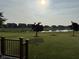 Expansive backyard featuring a serene pond and lush green space, ideal for outdoor enjoyment and relaxation at 15961 Foothill Dr, Noblesville, IN 46060