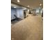 Finished basement with exercise equipment, a ping pong table, and ample space for entertainment at 15961 Foothill Dr, Noblesville, IN 46060