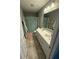 Bathroom featuring double sinks, a large mirror, a shower/tub with curtain, and ample cabinet space at 15961 Foothill Dr, Noblesville, IN 46060