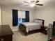 Cozy bedroom with dark wood furniture, a comfortable bed, and soft natural lighting at 15961 Foothill Dr, Noblesville, IN 46060