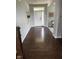 Inviting foyer with hardwood floors, neutral walls, and a stylish front door with sidelight windows at 15961 Foothill Dr, Noblesville, IN 46060