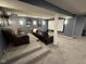 Basement home theater with tiered seating, a projector screen, and atmospheric lighting at 15961 Foothill Dr, Noblesville, IN 46060
