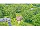 Expansive aerial perspective showcasing a property nestled among mature trees in a tranquil neighborhood at 1660 Obara Ct, Carmel, IN 46033