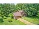 Beautiful aerial view of a suburban home surrounded by mature trees and lush green landscaping at 1660 Obara Ct, Carmel, IN 46033