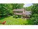 Aerial view of a home's lush backyard showcasing a patio area with outdoor seating at 1660 Obara Ct, Carmel, IN 46033