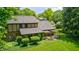 The backyard boasts a covered patio and lush greenery providing a peaceful outdoor retreat at 1660 Obara Ct, Carmel, IN 46033