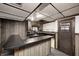 Finished basement featuring bar area, sink, wood paneling, and a neutral carpet at 1660 Obara Ct, Carmel, IN 46033