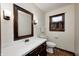 Cozy bathroom featuring a vanity with mirror and decorative dark wood at 1660 Obara Ct, Carmel, IN 46033