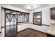 Dining area showcasing hardwood floors, a window, and elegant woodwork details, creating a warm and inviting space at 1660 Obara Ct, Carmel, IN 46033
